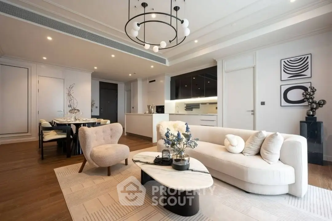 Luxurious open-plan living room with modern decor and elegant lighting