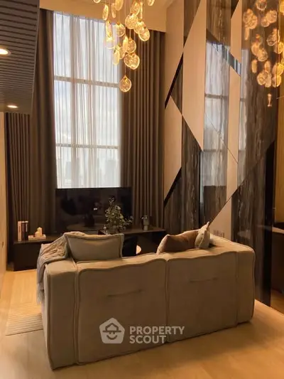 Luxurious modern living room with high ceilings and elegant lighting