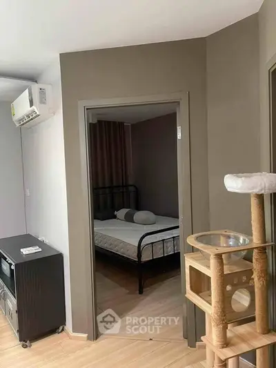 Cozy bedroom with modern decor and pet-friendly features in a stylish apartment.
