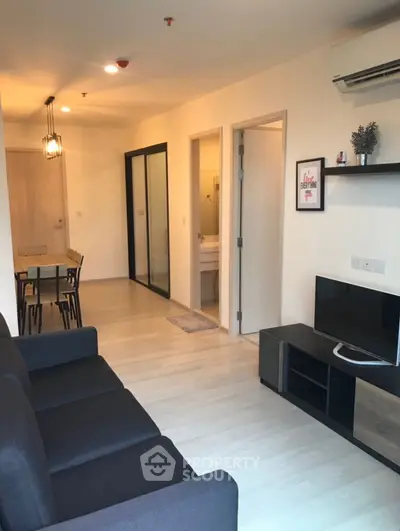 Modern living room with sleek furniture and open layout, perfect for contemporary urban living.