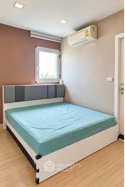 Modern bedroom with minimalist design and air conditioning