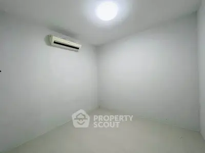 Minimalist empty room with air conditioning, perfect for customization and personal touch.