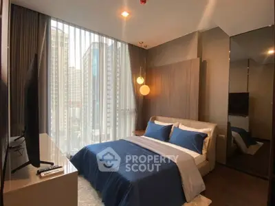 Luxurious bedroom with city view, modern decor, and elegant lighting in high-rise apartment.