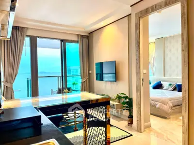 Luxurious open-plan living room with stunning ocean view and elegant bedroom