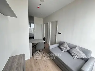 Modern compact living room with minimalist decor and cozy seating