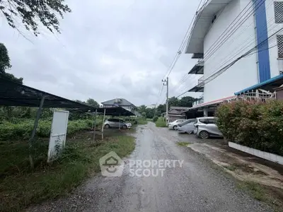 Charming rural property with ample parking and lush greenery, perfect for tranquil living.