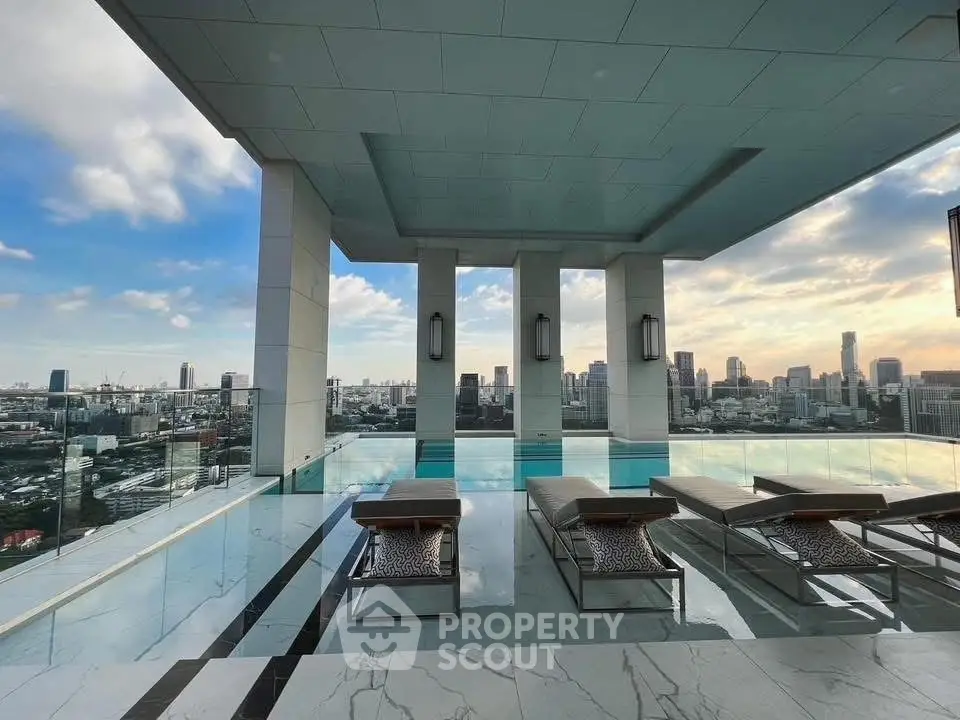 Luxurious rooftop pool with stunning city skyline views, perfect for relaxation and entertainment.