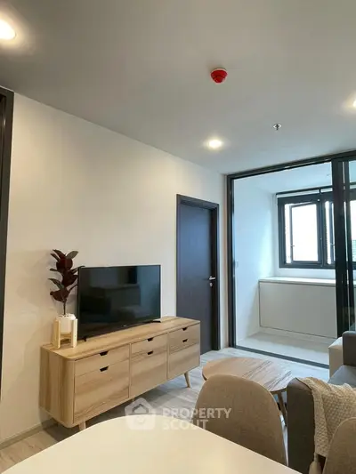 Modern living room with sleek TV stand and cozy seating area