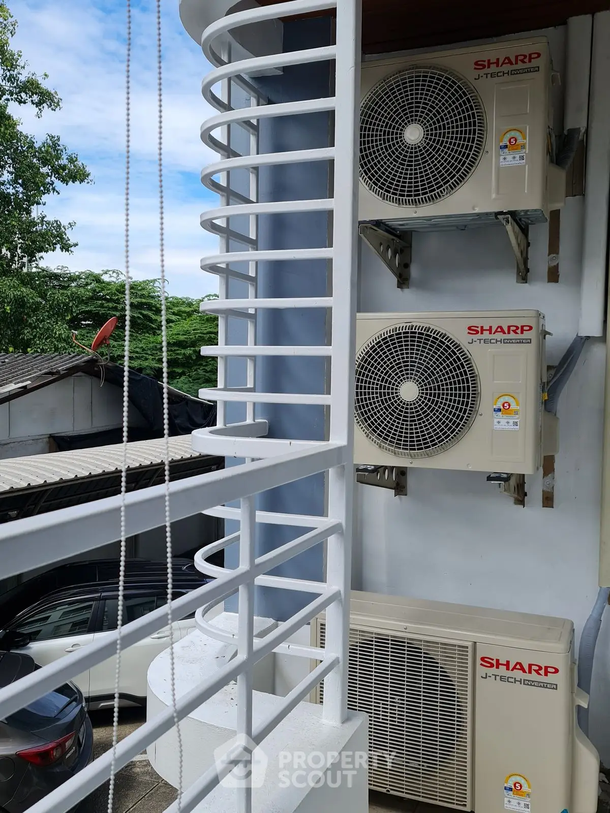 Modern building exterior with multiple air conditioning units installed, showcasing efficient cooling solutions.