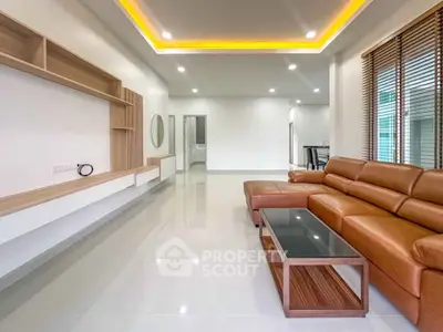 Spacious modern living room with sleek furniture and ambient lighting