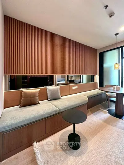 Modern living room with stylish wood paneling and cozy seating area