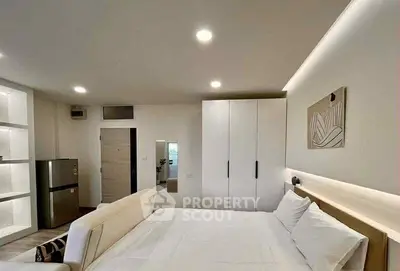 Modern bedroom with sleek design and ambient lighting