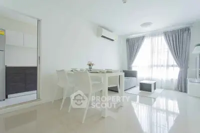 Bright and modern living room with dining area and natural light