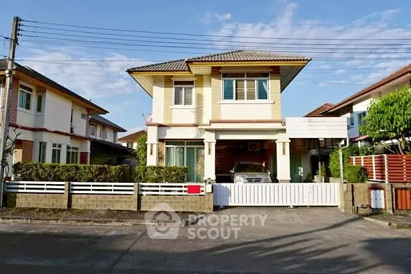 Charming two-story house with modern design and spacious driveway in a serene neighborhood.