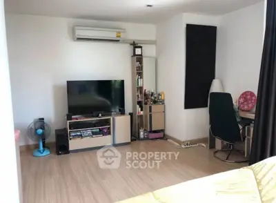 Cozy living room with modern decor and entertainment setup