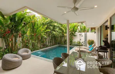 Luxurious tropical villa with private pool and lush garden, perfect for relaxation and entertaining.