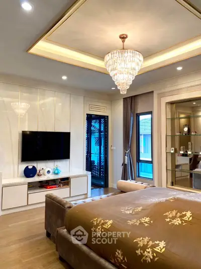 Luxurious bedroom with elegant chandelier and modern decor