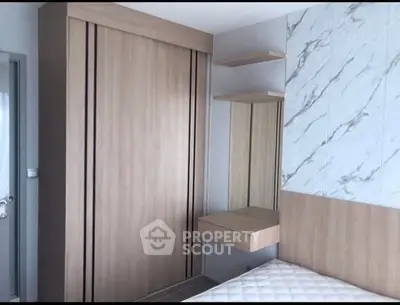 Modern bedroom with built-in wardrobe and marble accent wall