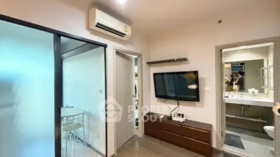Modern apartment interior with wall-mounted TV and air conditioning