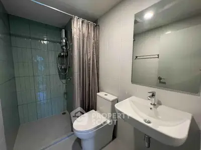 Modern bathroom with sleek fixtures and a spacious shower area