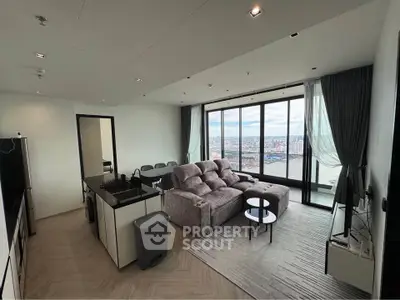 Spacious modern living room with panoramic city view and elegant furnishings.