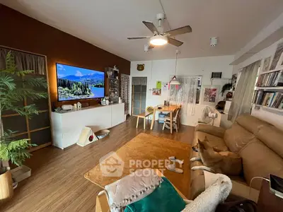 Spacious living room with modern decor and cozy seating area