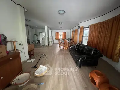 Spacious living room with modern furniture and wooden flooring