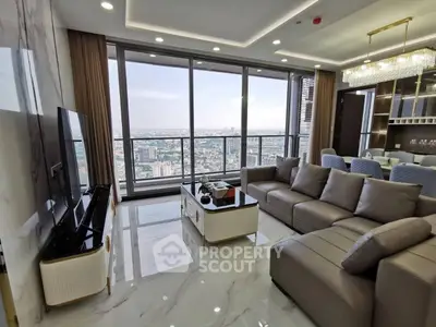 Luxurious living room with panoramic city view and modern furnishings.