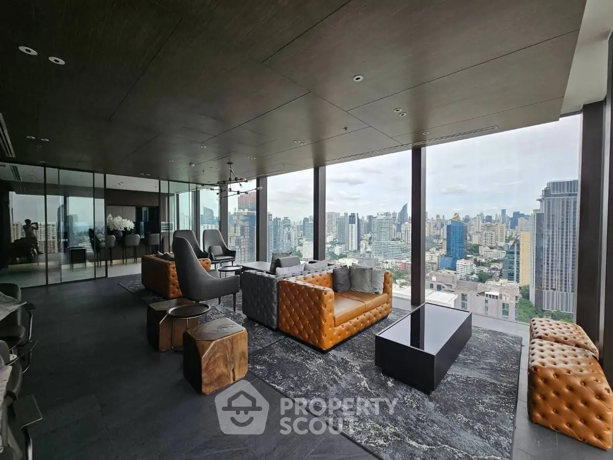 Luxurious high-rise living room with panoramic city views and modern furnishings.
