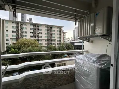 Charming balcony view with cityscape backdrop, perfect for urban living enthusiasts seeking a serene outdoor space.
