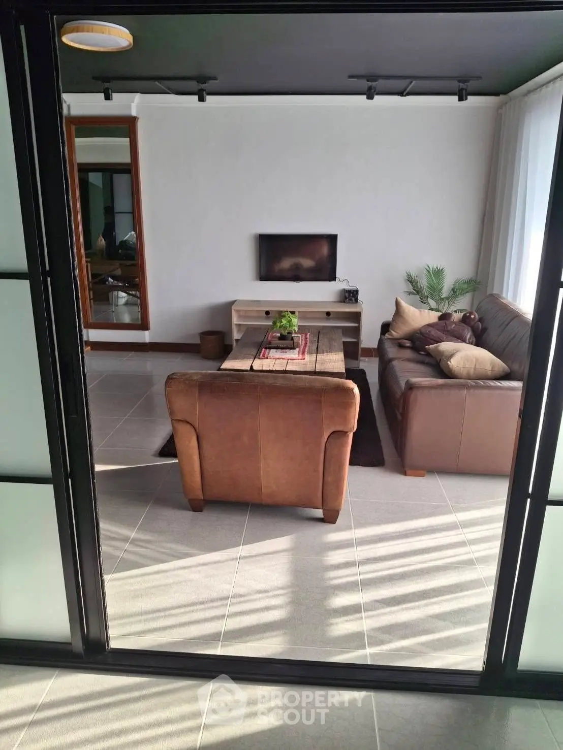 Stylish living room with leather sofas and modern decor