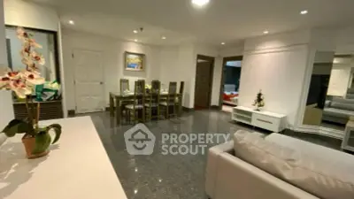 Spacious living room with elegant dining area and modern decor