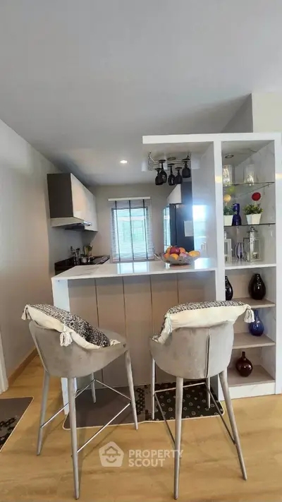 Modern kitchen with stylish bar stools and open shelving