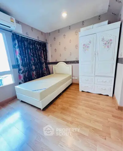 Charming bedroom with floral wallpaper and elegant white furniture