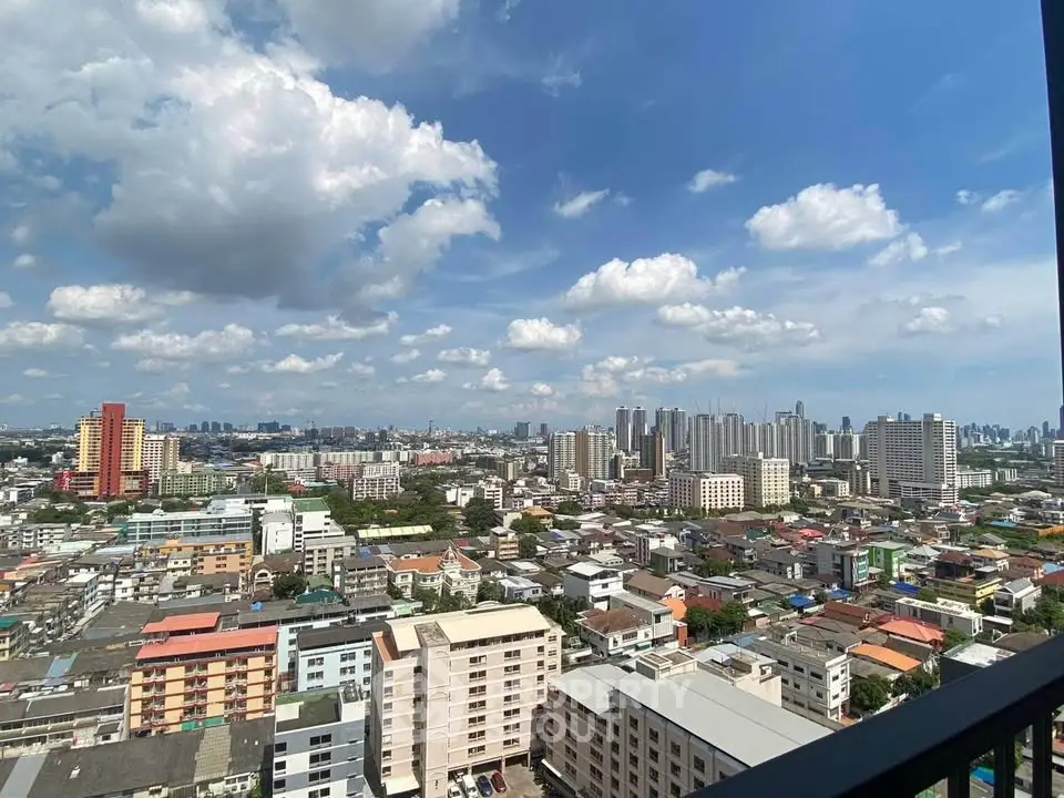 Stunning cityscape view from high-rise balcony showcasing urban skyline and vibrant neighborhood.