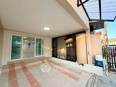 Spacious covered patio with modern design and large windows