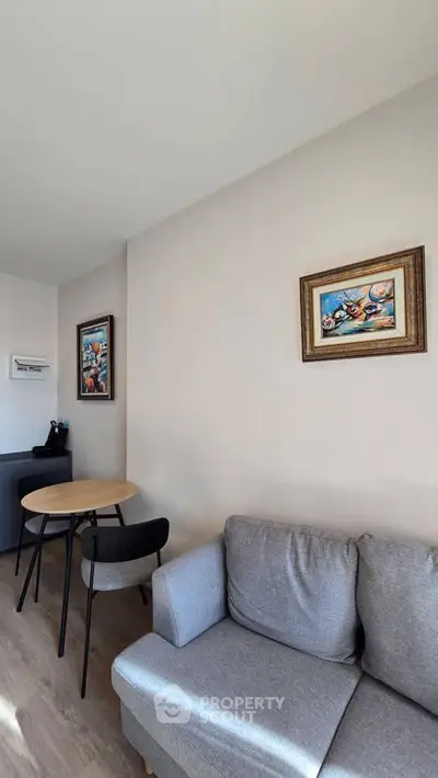 Modern living room with stylish decor and cozy seating area, perfect for relaxation and entertaining.