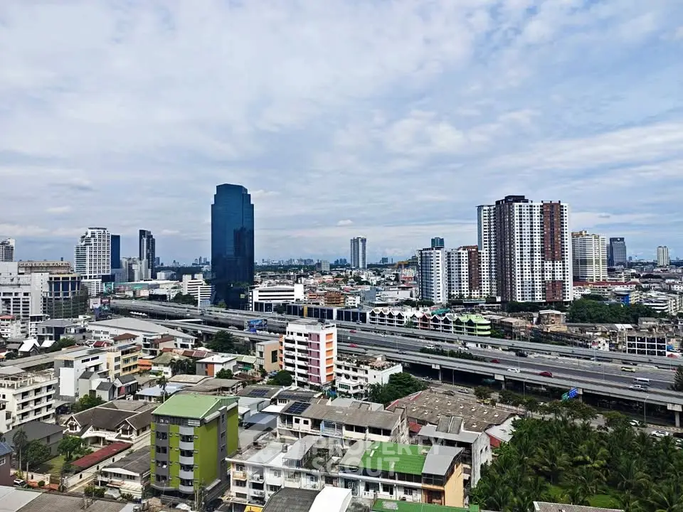 Stunning cityscape view showcasing modern skyscrapers and residential buildings under a clear blue sky.