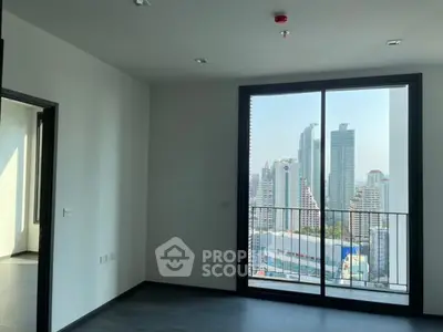 Modern apartment with city view and large windows, offering abundant natural light and sleek design.