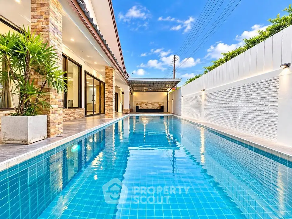 Luxurious modern home with stunning private pool and elegant outdoor design.