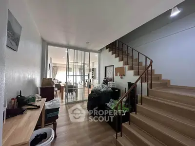 Spacious modern interior with wooden staircase and open living area