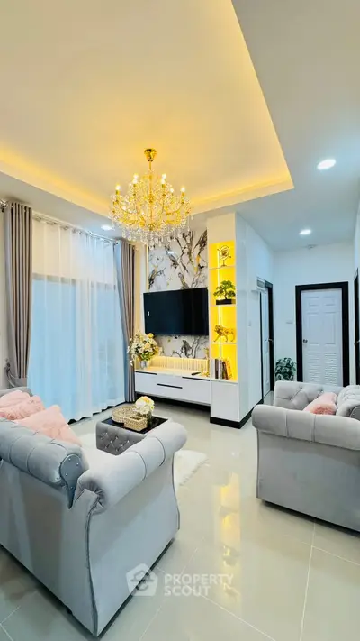 Luxurious living room with elegant chandelier and modern decor