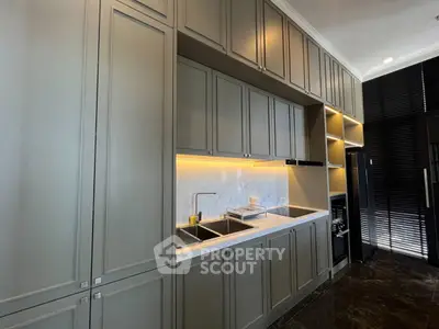 Modern kitchen with sleek cabinetry and under-cabinet lighting