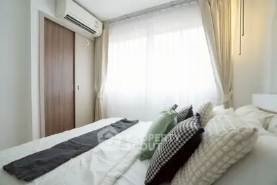 Cozy bedroom with modern decor and natural light