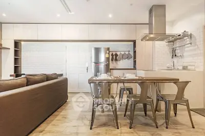 Modern open kitchen with dining area and stylish decor