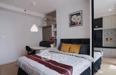 Modern bedroom with stylish decor and cozy ambiance in a contemporary apartment.