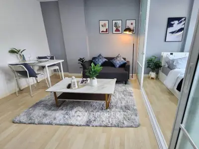 Modern living room with cozy decor and stylish furniture, perfect for urban living.