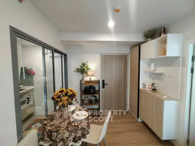 Charming dining area with modern decor and cozy ambiance in a stylish apartment.