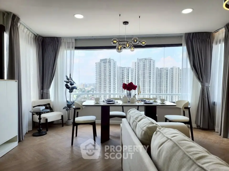 Luxurious living room with panoramic city view and elegant dining area