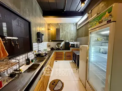 Stylish industrial kitchen with modern appliances and ample storage space